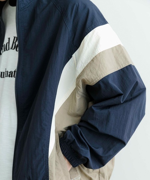 ITEMS URBANRESEARCH(アイテムズ アーバンリサーチ)の「配色キリカエ ナイロン トラックジャケット(ブルゾン・メンズ・ブラック/ネイビー・MEDIUM/LARGE)」の13枚目の写真
