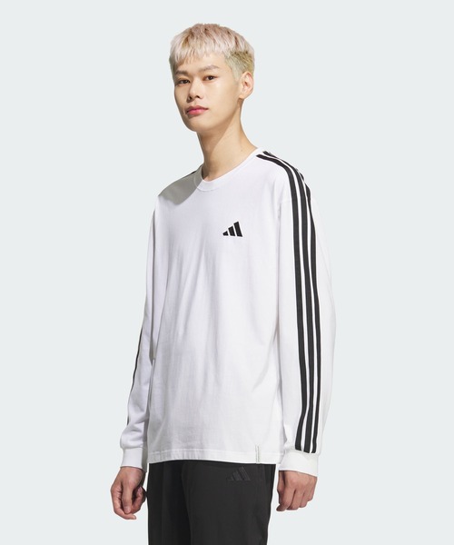 adidas(アディダス)の「エッセンシャルズ プラス ルーズフィット スリーストライプス シングルジャージー 長袖Tシャツ / ロンT / アディダス adidas(Tシャツ/カットソー・メンズ・ホワイト・XX-LARGE/3XL/LARGE/MEDIUM/SMALL/X-LARGE/X-SMALL)」の1枚目の写真