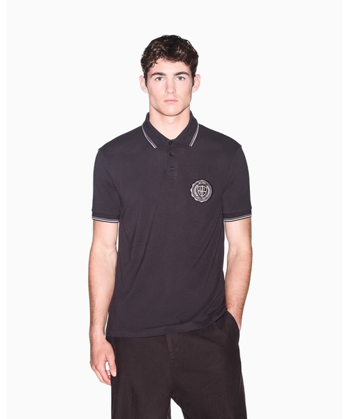 ARMANI EXCHANGE(アルマーニエクスチェンジ)の「【A|X アルマーニ エクスチェンジ】CO エンブレムロゴ スリムフィット 半袖ポロシャツ/SLIM(ポロシャツ・メンズ・グレイッシュベージュ/チャコールグレー・X-LARGE/SMALL/MEDIUM/LARGE/X-SMALL)」の1枚目の写真