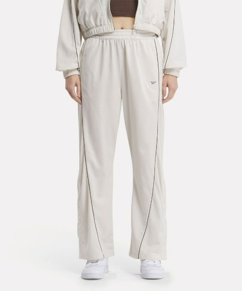 Reebok(リーボック)の「クラシック バスケットボール トラックパンツ / CL CS BBALL TP(スウェットパンツ・レディース・ライトベージュ/ダークブルー・LARGE/MEDIUM/SMALL/X-LARGE)」の1枚目の写真