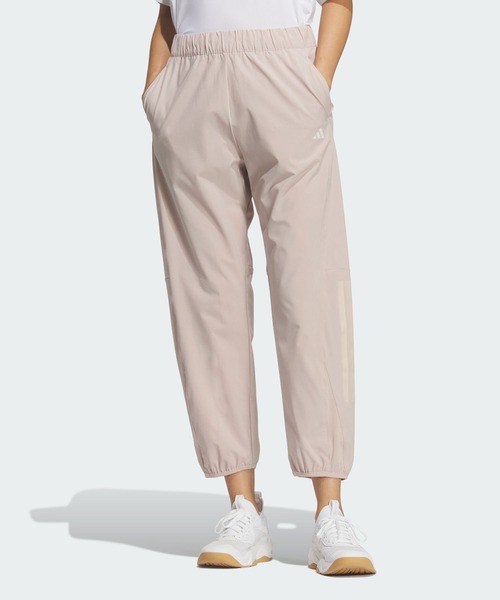 adidas(アディダス)の「トレーニング エッセンシャルズ プラス ルーズフィット ストレッチ ウーブン 9/10 テーパード パンツ / アディダス adidas(スウェットパンツ・レディース・ベージュ・X-LARGE/SMALL/MEDIUM/LARGE/XX-LARGE)」の1枚目の写真