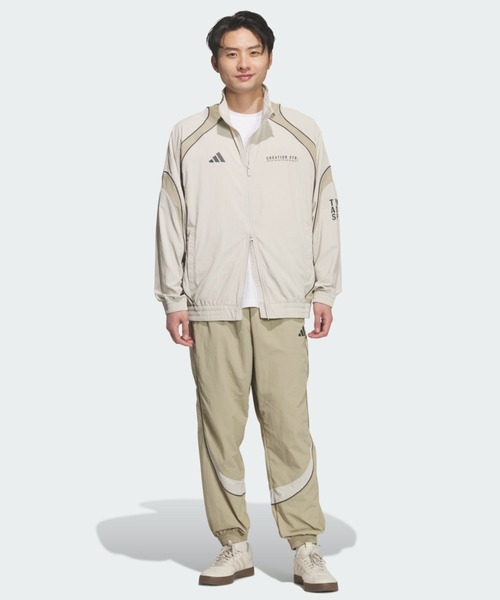 adidas(アディダス)の「BRAND LOVE ルーズフィット ライト ウーブン ジャケット / アディダス adidas(ジャージ・メンズ・ベージュ・X-SMALL/X-LARGE/SMALL/XX-LARGE/3XL/LARGE/MEDIUM)」の3枚目の写真