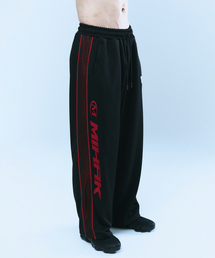 MIHAK（ミハク）の「スポンサー ロゴ メッシュ ジャージ ワイドパンツ (ブラック/レッド)（スウェットパンツ）」