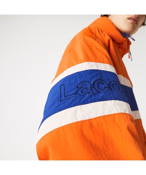 LACOSTE L!VE(ラコステライブ)の「LACOSTE L!VE ボーダープリントアノラック(カバーオール・メンズ・オレンジ・46/48/52/50)」の4枚目の写真