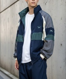 Reebok（リーボック）の「トラックジャケット リブート 90’s/Track Jacket REBOOT 90’s（ナイロンジャケット）」
