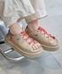 UGG（アグ）の「W GOLDENGLOW TOGGLE　1179370-MDSD（サンダル・5）」