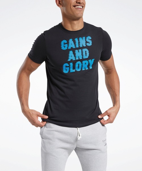 Reebok(リーボック)の「グラフィック ショート スリーブ Tシャツ /Graphic Short Sleeve Tee(Tシャツ/カットソー・メンズ・ブラック・X-SMALL/X-LARGE/SMALL/LARGE/MEDIUM/XX-LARGE)」の1枚目の写真