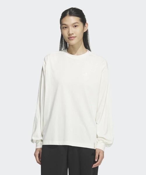 adidas(アディダス)の「エッセンシャルズ プラス スリー ストライプス ルーズ フィット 長袖 Tシャツ / ロンT / アディダス adidas(Tシャツ/カットソー・レディース・ホワイト・XX-LARGE/LARGE/MEDIUM/SMALL/X-LARGE/X-SMALL)」の1枚目の写真