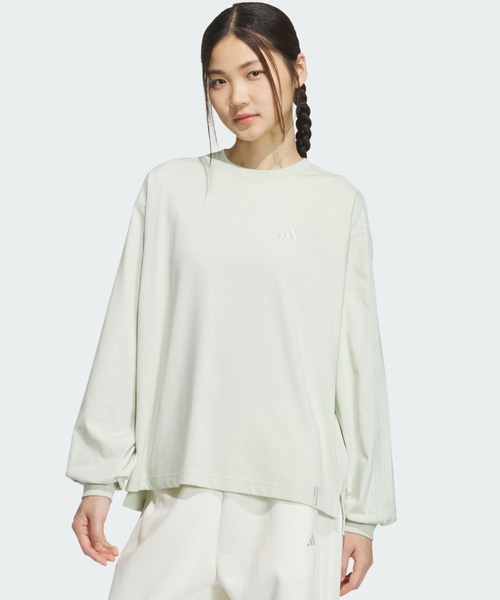 adidas(アディダス)の「エッセンシャルズ プラス スリー ストライプス ルーズ フィット 長袖 Tシャツ / ロンT / アディダス adidas(Tシャツ/カットソー・レディース・グリーン・XX-LARGE/LARGE/MEDIUM/SMALL/X-LARGE/X-SMALL)」の1枚目の写真