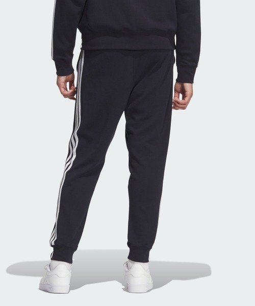 adidas(アディダス)の「エッセンシャルズ プラス レギュラーフィット スリーストライプス フレンチテリー フルレングス カフ パンツ / アディダス adidas(その他パンツ・メンズ・ブルー・X-SMALL/XX-LARGE/3XL/X-LARGE/SMALL/MEDIUM/LARGE)」の2枚目の写真