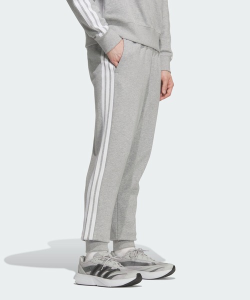 adidas(アディダス)の「エッセンシャルズ プラス レギュラーフィット スリーストライプス フレンチテリー フルレングス カフ パンツ / アディダス adidas(その他パンツ・メンズ・グレー・X-LARGE/X-SMALL/XX-LARGE/3XL/SMALL/LARGE/MEDIUM)」の1枚目の写真