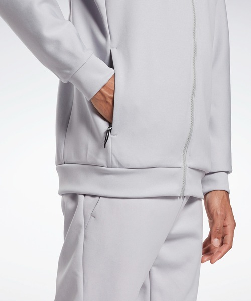 Reebok(リーボック)の「DMX ストレッチ ピケ トラックジャケット / DMX Stretch Pique Track Jacket(ナイロンジャケット・メンズ・グレー/ブラック・MEDIUM/XX-LARGE/XXX-LARGE/X-SMALL/SMALL/X-LARGE/LARGE)」の5枚目の写真