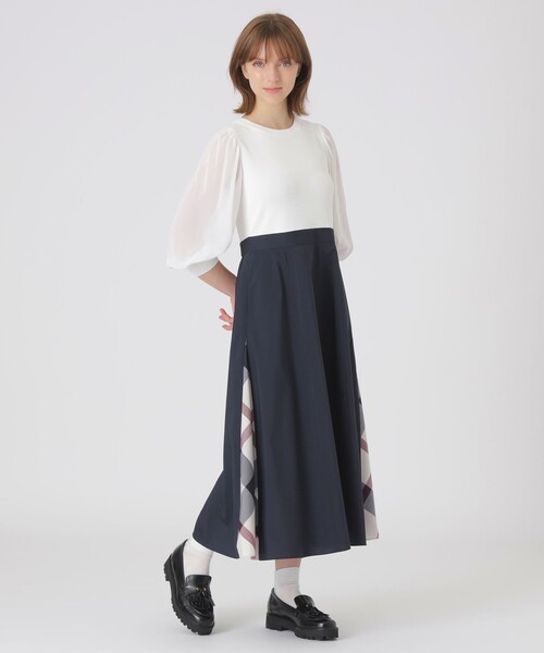 BLUE LABEL CRESTBRIDGE(ブルーレーベルクレストブリッジ)の「シアースリーブニットドッキングドレス(ワンピース・レディース・ブラック/オフホワイト・36/40/38)」の1枚目の写真