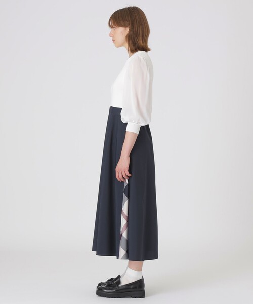 BLUE LABEL CRESTBRIDGE(ブルーレーベルクレストブリッジ)の「シアースリーブニットドッキングドレス(ワンピース・レディース・ブラック/オフホワイト・36/40/38)」の3枚目の写真