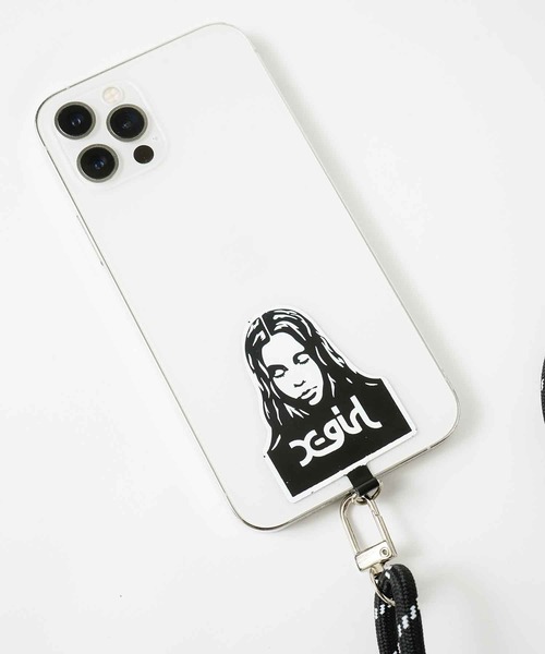 X-girl（エックスガール）の「FACE PHONE STRAP（スマホグッズ・レディース・ブラック・ONE SIZE）」の2枚目の写真