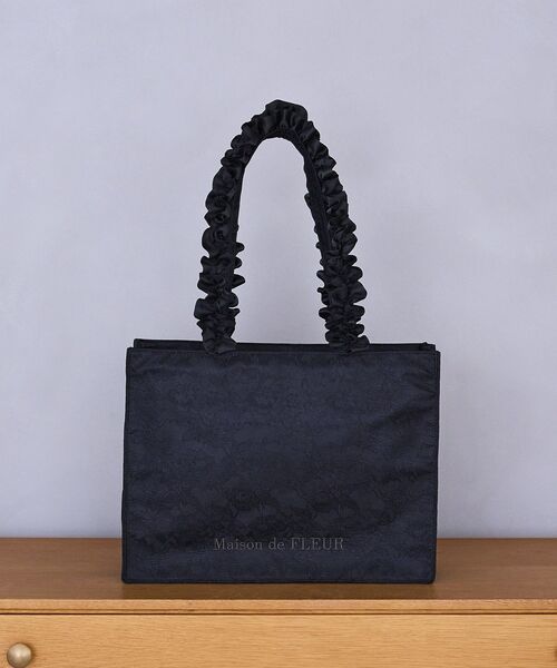 Maison de FLEUR(メゾンドフルール)の「レースフリルハンドルスクエアトートバッグ(トートバッグ・レディース・ライトピンク/ブラック・FREE)」の1枚目の写真