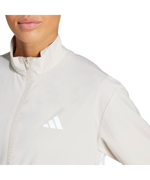 adidas(アディダス)の「アディダス adidas トレイン エッセンシャルズ スリーストライプス ウーブン ウォームアップジャケット(ジャージ・レディース・ベージュ/ブラック・S/M/L)」の4枚目の写真