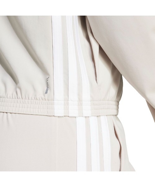 adidas(アディダス)の「アディダス adidas トレイン エッセンシャルズ スリーストライプス ウーブン ウォームアップジャケット(ジャージ・レディース・ベージュ/ブラック・S/M/L)」の5枚目の写真