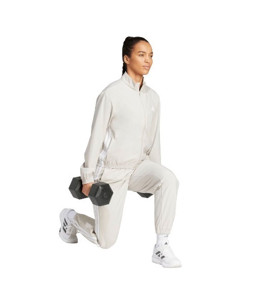 adidas(アディダス)の「アディダス adidas トレイン エッセンシャルズ スリーストライプス ウーブン ウォームアップジャケット(ジャージ・レディース・ベージュ/ブラック・S/M/L)」の6枚目の写真