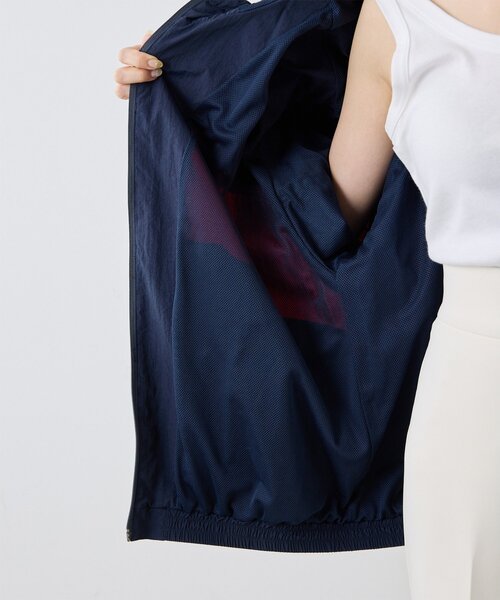 UMBRO(アンブロ)の「【umbro×Whim Gazette】 フーディーブルゾン(ブルゾン・レディース・アイボリー/ネイビー・FREE)」の4枚目の写真