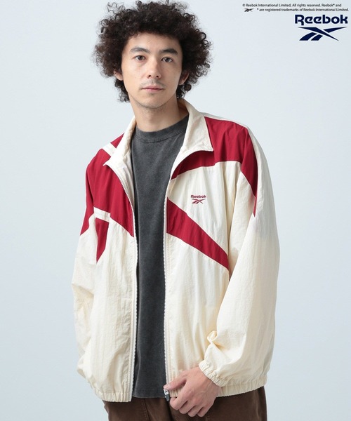 Reebok(リーボック)の「【Reebok】別注トラックジャケット(ナイロンジャケット・メンズ・ホワイト/レッド/ネイビー/グリーン/ブラック系/パープル/オフホワイト/グレー/ブラック/ホワイト×レッド/ブラック×グレー/ダークグリーン/ブラック系その他/ブルー系その他/ホワイト系その他/シルバー/ブラック系その他2/ホワイト×ブルー/ブルー/ピンク・MEDIUM/LARGE)」の4枚目の写真
