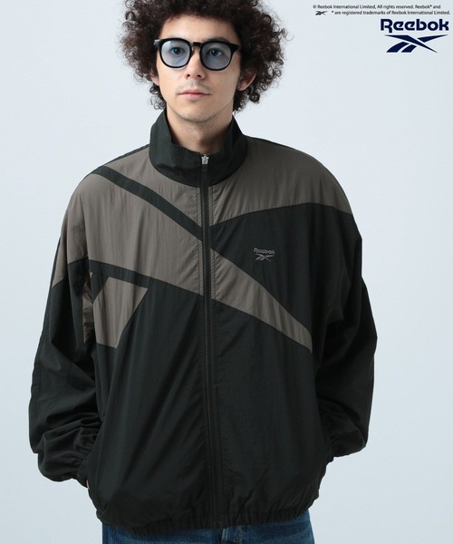 Reebok(リーボック)の「【Reebok】別注トラックジャケット(ナイロンジャケット・メンズ・ホワイト/レッド/ネイビー/グリーン/ブラック系/パープル/オフホワイト/グレー/ブラック/ホワイト×レッド/ブラック×グレー/ダークグリーン/ブラック系その他/ブルー系その他/ホワイト系その他/シルバー/ブラック系その他2/ホワイト×ブルー/ブルー/ピンク・MEDIUM/LARGE)」の7枚目の写真