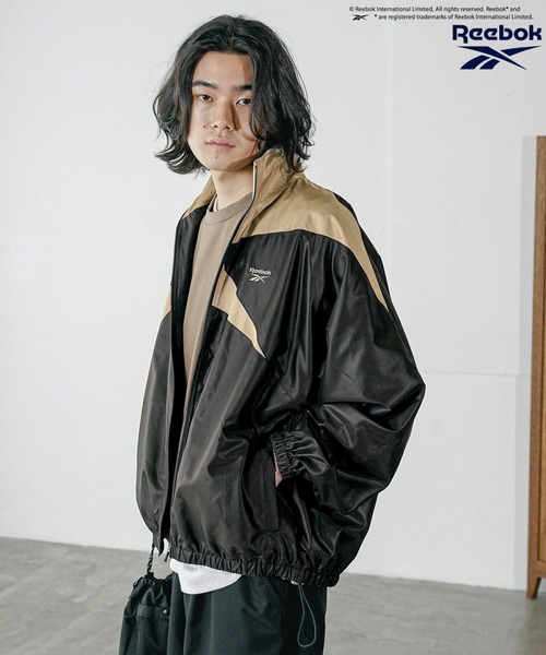 Reebok(リーボック)の「【Reebok】別注トラックジャケット(ナイロンジャケット・メンズ・ホワイト/レッド/ネイビー/グリーン/ブラック系/パープル/オフホワイト/グレー/ブラック/ホワイト×レッド/ブラック×グレー/ダークグリーン/ブラック系その他/ブルー系その他/ホワイト系その他/シルバー/ブラック系その他2/ホワイト×ブルー/ブルー/ピンク・MEDIUM/LARGE)」の22枚目の写真