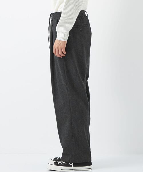 green label relaxing by 風早ゆうた（グリーンレーベルリラクシングバイカゼハヤユウタ）の「【WEB限定】＜KZ×green label relaxing＞ホームスパン 1P パンツ -セットアップ可能-（スラックス・メンズ・ブラック・S/L/M）」の2枚目の写真