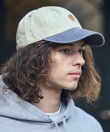 UN-FILLED（アンフィルド）の「mko13355- GARBERA EMB PIGMENT CAP キャップ(SDUF-2609)（キャップ）」