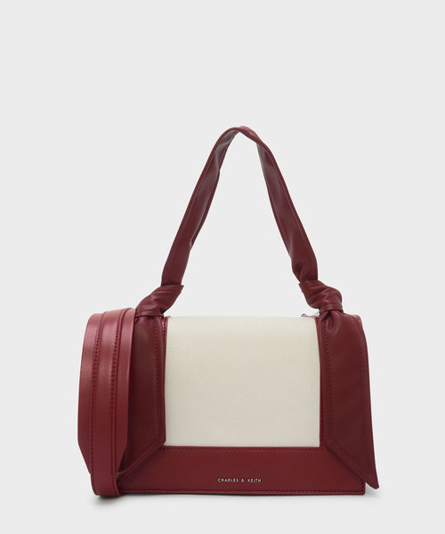 CHARLES & KEITH（チャールズ & キース）の「ノーテッドストラップハンドバッグ / KNOTED STRAP HANDBAG（ハンドバッグ・レディース・レッド/ライトベージュ/ブラック・M）」の2枚目の写真