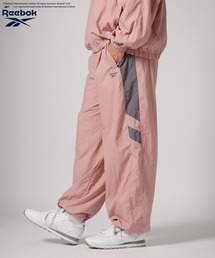 Reebok（リーボック）の「【Reebok(リーボック)】別注トラックパンツ[セットアップ可]（その他パンツ）」