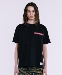 Alpha Industries（アルファインダストリーズ）の「Alpha Industries アルファインダストリーズ ALPHA RED RIBBON T-SHIRT アルファ レッド リボン Tシャツ（Tシャツ/カットソー）」