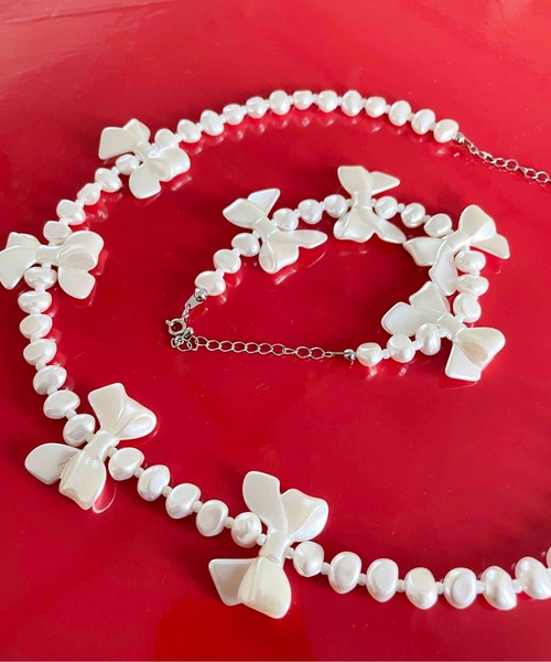 Casselini(キャセリーニ)の「Casselini(キャセリーニ)リボンリボンネックレス(ネックレス・レディース・オフホワイト・FREE)」の5枚目の写真