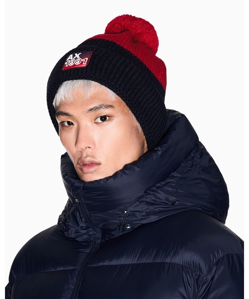 ARMANI EXCHANGE(アルマーニエクスチェンジ)の「【A|X アルマーニ エクスチェンジ】AXロゴ ポンポン ニットキャップ(ニットキャップ/ビーニー・メンズ・ネイビー・FREE)」の1枚目の写真