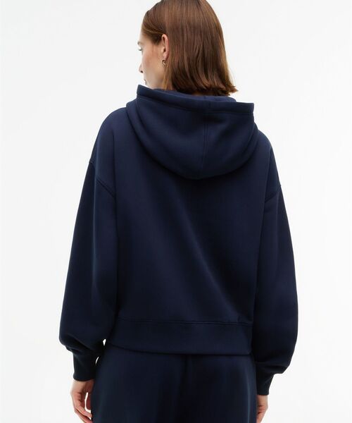 TOMMY HILFIGER(トミーヒルフィガー)の「バーシティフロッキーリラックスパーカー(スウェット・レディース・ネイビー/グレー・X-SMALL/SMALL)」の5枚目の写真