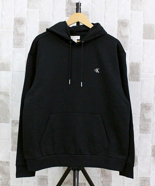 Calvin Klein(カルバン・クライン)の「CK アーカイブフリース プルオーバーフーディ LS ARCHIVE FLEECE PO HOODIE(パーカー・メンズ・ブラック/ホワイト・L/XL/S/M)」の1枚目の写真