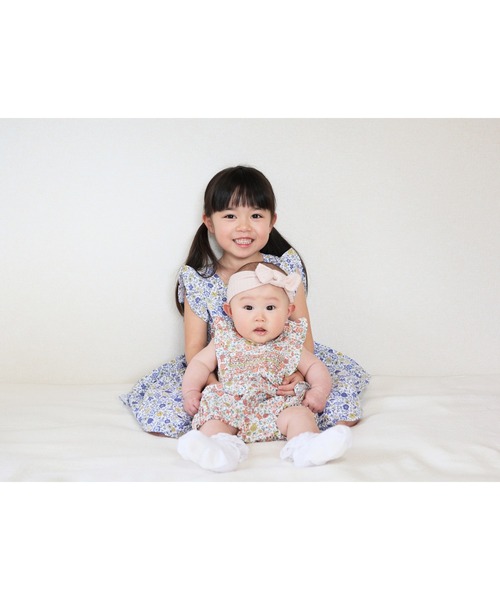 トロッターズ  TROTTERS  ブルー花柄スモッキングワンピース トロッターズ TROTTERS ブルー花柄スモッキングワンピース