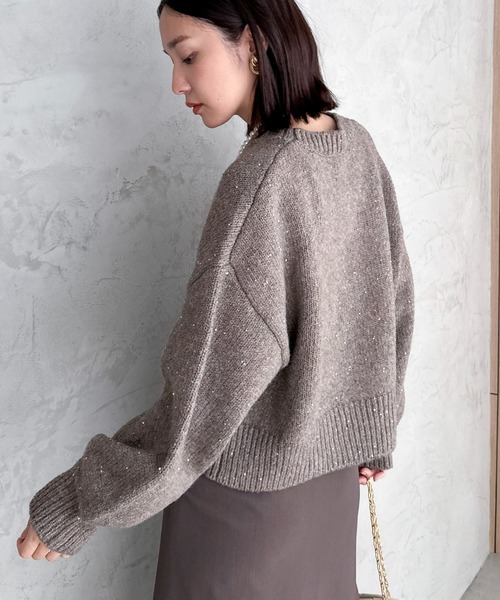 Doux archives（ドゥアルシーヴ）の「スパンコールショートニットプル