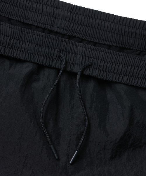 MUSINSA STANDARD（ムシンサスタンダード）の「裏起毛ナイロンワイドストリングパンツ[ブラック]（その他パンツ・メンズ・その他・42/36/34/32/30/26/28/38/40）」の4枚目の写真