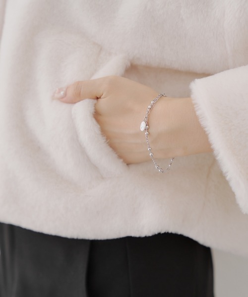 continuer de NICE CLAUP（コンティニューデナイスクラップ）の「キラキラ釦ファーブルゾン（ブルゾン・レディース・ブラック/ピンクベージュ/アイボリー・FREE）」の10枚目の写真