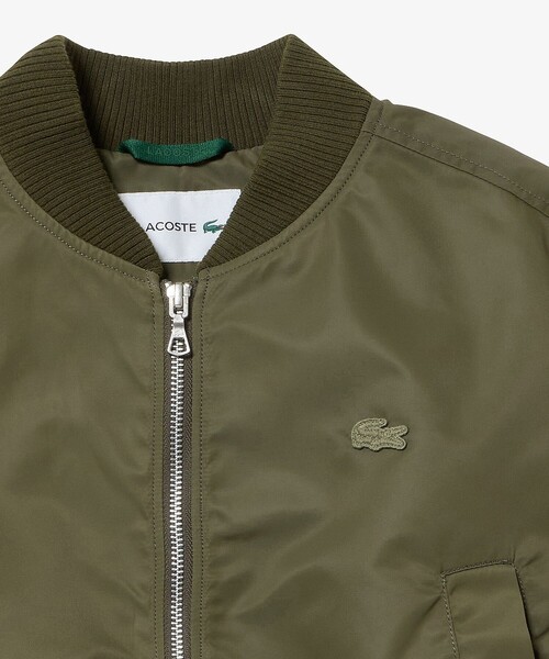 LACOSTE（ラコステ）の「クロップド丈 ショートMA-1ジャケット（ブルゾン・レディース・オリーブ/グレー・38/36/34/40）」の15枚目の写真