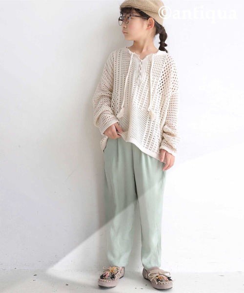 antiqua（アンティカ）の「タッセル紐付き透かし編みニット