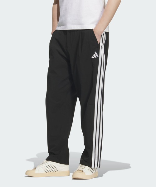 adidas(アディダス)の「ストレッチ ツイル ルーズフィット テーパードレッグ 10分丈 オープンヘム パンツ / アディダス adidas(その他パンツ・メンズ・ブラック×ホワイト・XX-LARGE/3XL/LARGE/MEDIUM/SMALL/X-LARGE/X-SMALL)」の1枚目の写真