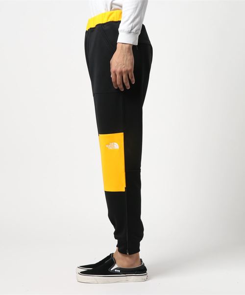 THE NORTH FACE（ザノースフェイス）の「ザ・ノース・フェイス メンズ 90'sヘリテージデザインジャージパンツ / ジャージパンツ（その他パンツ・メンズ・ブラック/ブラック×レッド/ブラック×イエロー・LARGE/MEDIUM/SMALL）」の4枚目の写真
