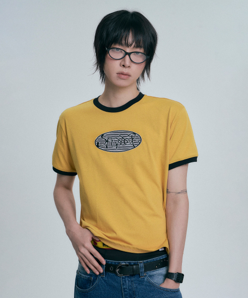 MOO(エムオーオー)の「オーバルロゴアプリケリングル半袖Tシャツ - マスタード(Tシャツ/カットソー・レディース・マスタード・MEDIUM/LARGE/SMALL)」の1枚目の写真