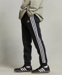 adidas（アディダス）の「エッセンシャルズ フリース テーパードカフ スリーストライプ パンツ / アディダス（その他パンツ・メンズ）」