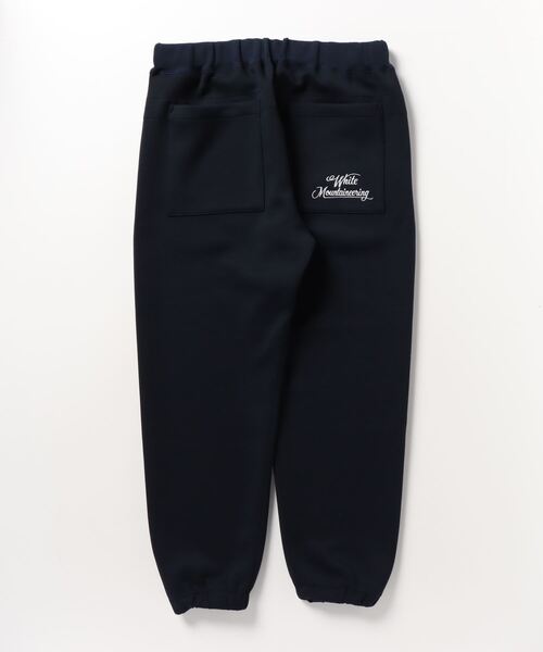 WHITE MOUNTAINEERING(ホワイトマウンテニアリング)の「WM LOGO EMBROIDERY SWEAT PANTS(スウェットパンツ・メンズ・ネイビー・3)」の2枚目の写真