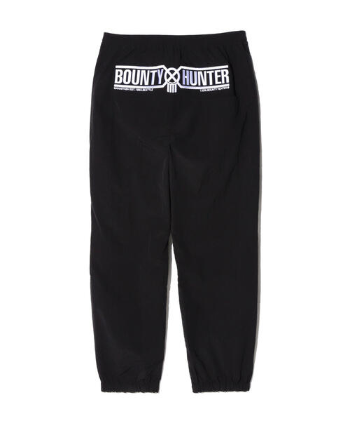 MANASTASH(マナスタッシュ)の「MANASTASH/マナスタッシュ/xBOUNTY HUNTER TRACK PANTS(その他パンツ・メンズ・ブラック・L/M/S/XL)」の2枚目の写真