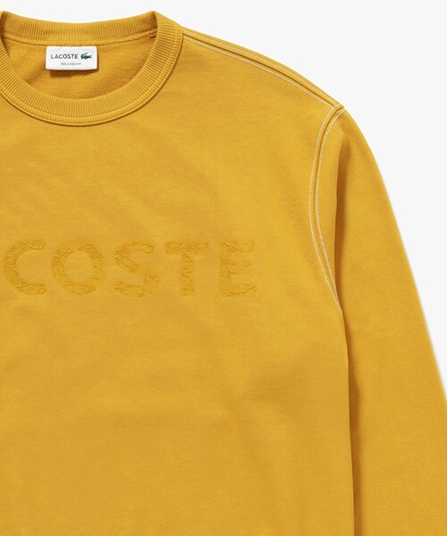 LACOSTE(ラコステ)の「エンザイムウォッシュ テクスチャーロゴ ヴィンテージクルーネックスウェット(スウェット・メンズ・イエロー/アイボリー/ダークグレー・4/3/2/5)」の3枚目の写真
