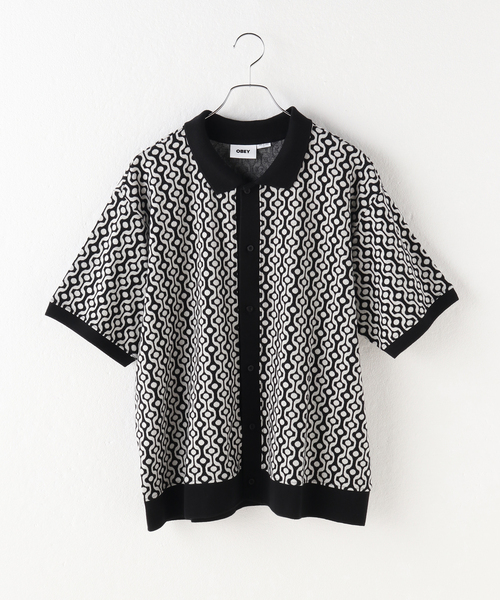 B.C STOCK(ベーセーストック)の「【OBEY / オベイ】 TESTAMENT BUTTON FRONT PL SS(ポロシャツ・メンズ・ブラック・LARGE/MEDIUM)」の1枚目の写真